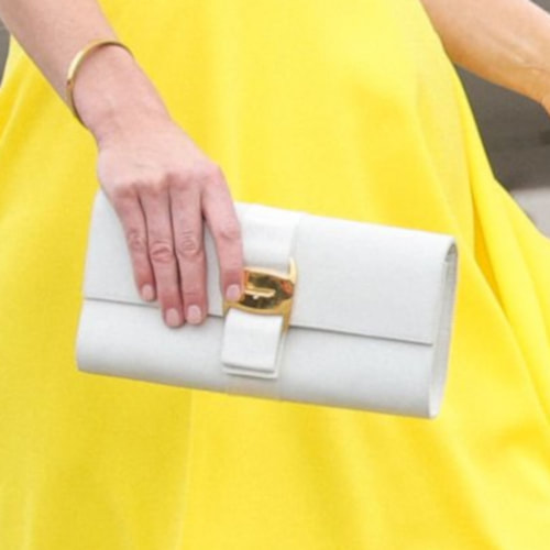 Kate carried a vintage Salvatore Ferragamo Vara bow clutch in white