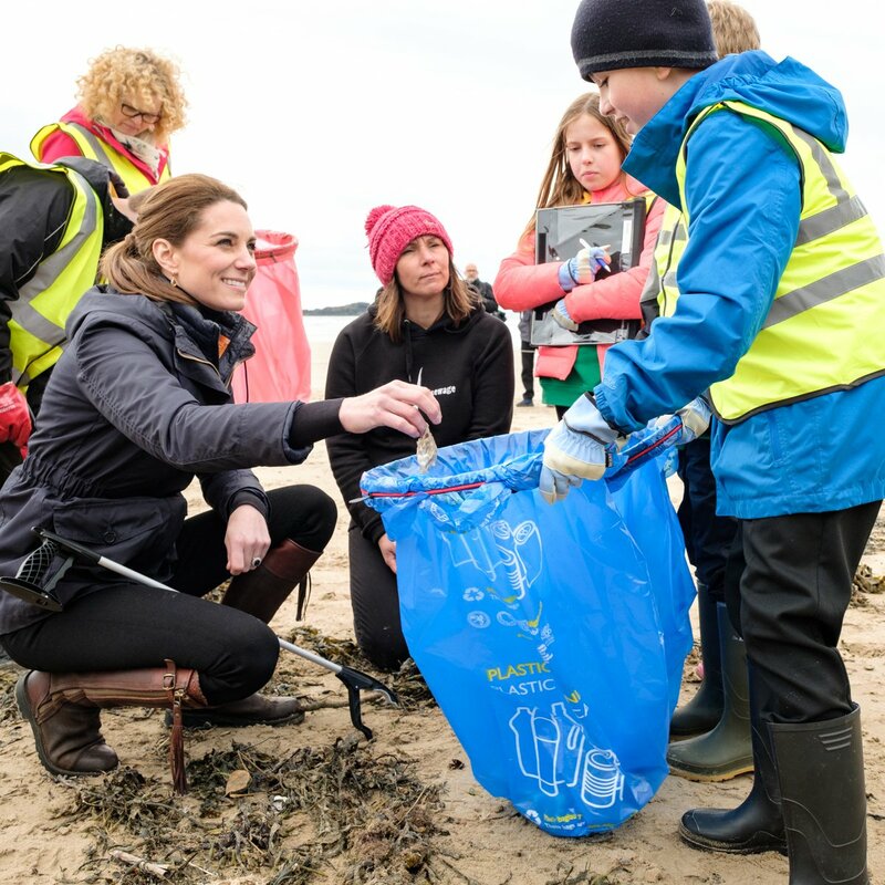 Catherin Duchess of Cambridge picks up litter on Anglesey beach.