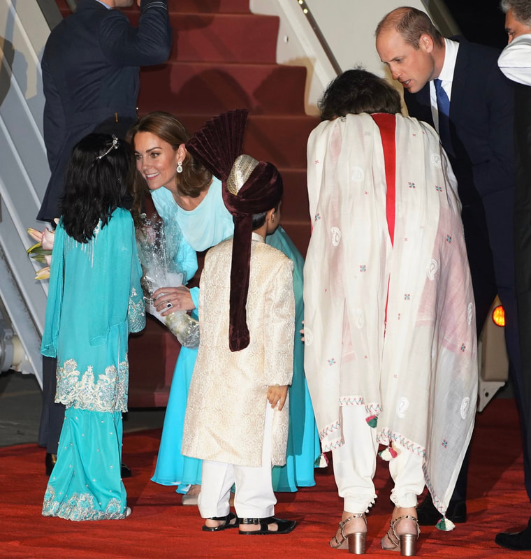 Duchess of Cambridge receives flowers at Pakistani Air Force Base Nur Khan, Rawalpindi