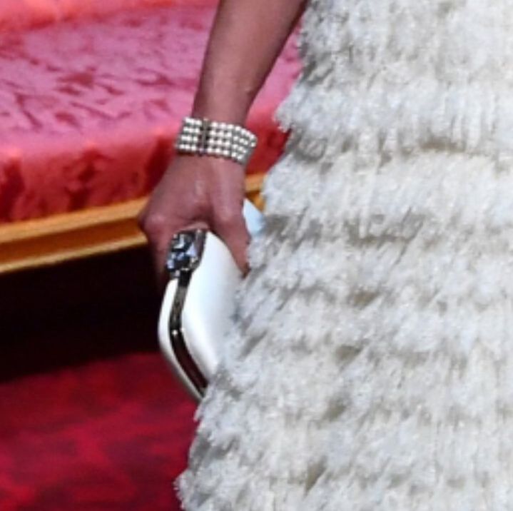 Prada jewel clasp clutch and four-stranded pearl bracelet 