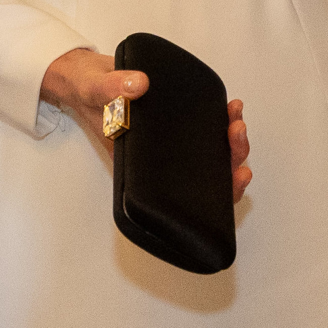 Princess Kate carries black Prada Satin Clutch with Stone Embellishment