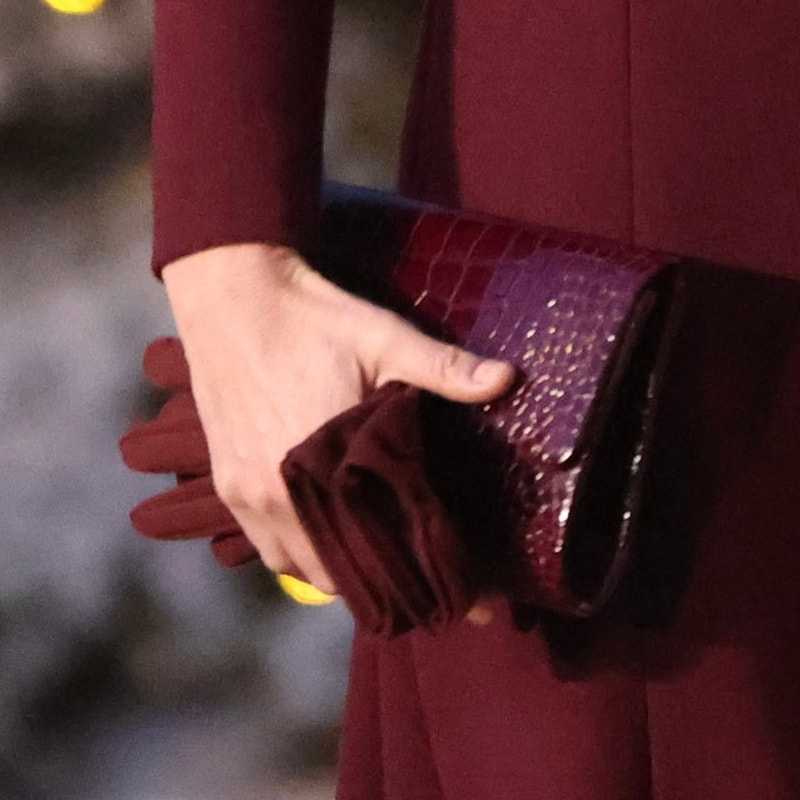 Catherine, Princess of Wales carries burgundy croc-embossed clutch and M&Co bow detail fleece gloves